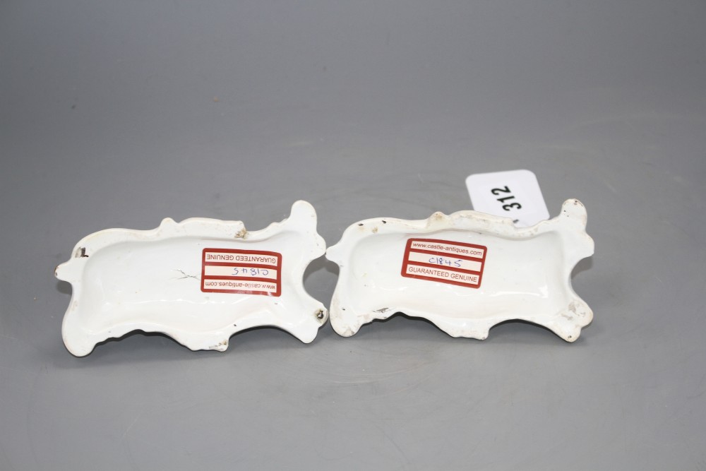 A pair of Staffordshire porcelain figures of recumbent greyhounds, c.1835-50, L. 12.2cm